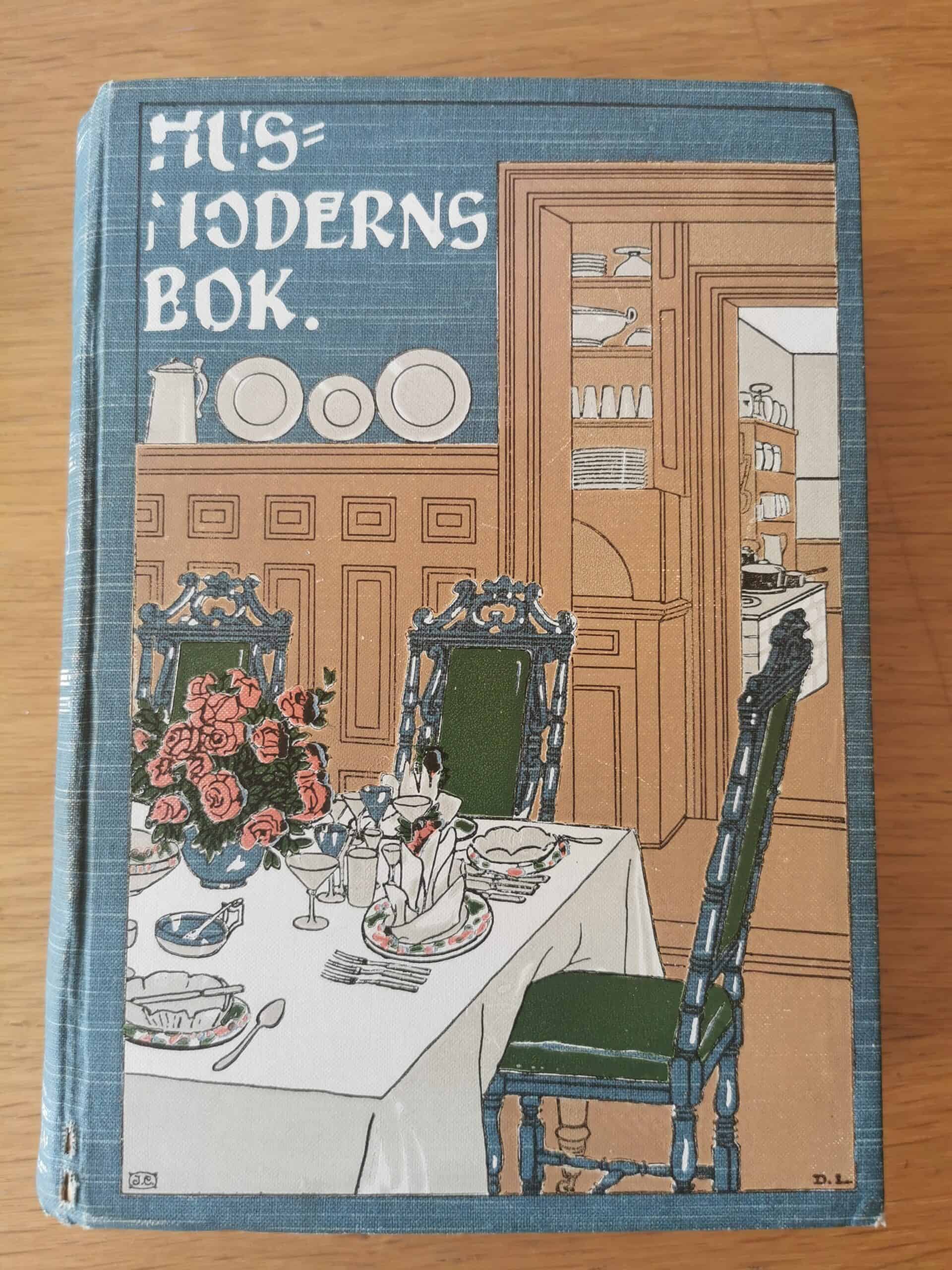 Omslaget av Husmoderns bok från 1907. 